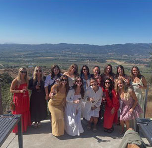 A celebration group on the estate terrace overlooking Napa Valley